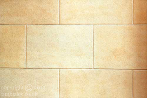 faux painted stone wall with trompe l'oeil mitred joints