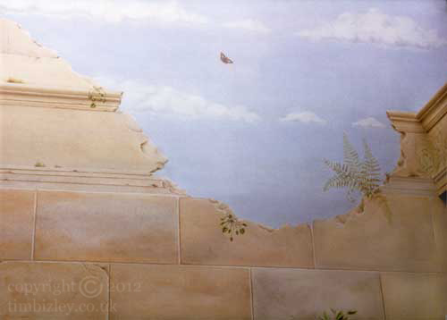faux stone blocking mural showing archaic ruins