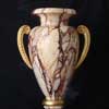 a faux marble and gilded architectural urn