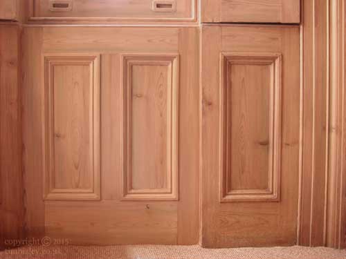 pine wood graining paint effect to dado panelling, sash boxes and shutters in living room 