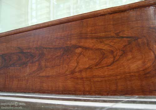faux woodgraining imitating Walnut heartwood on skirting board